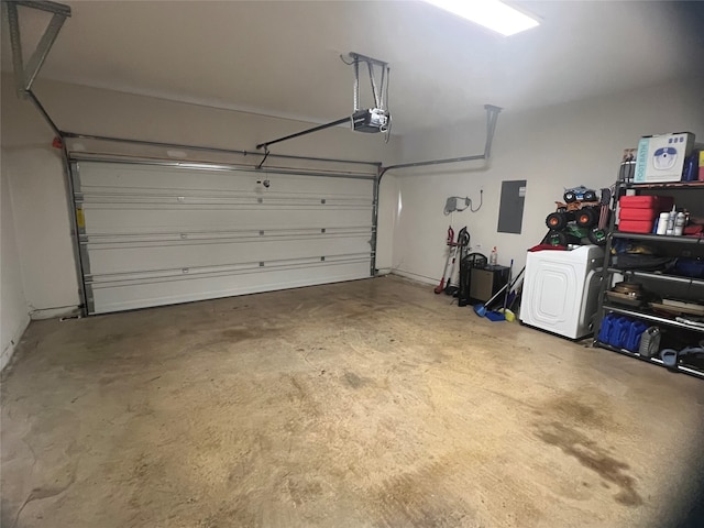 garage with a garage door opener and electric panel