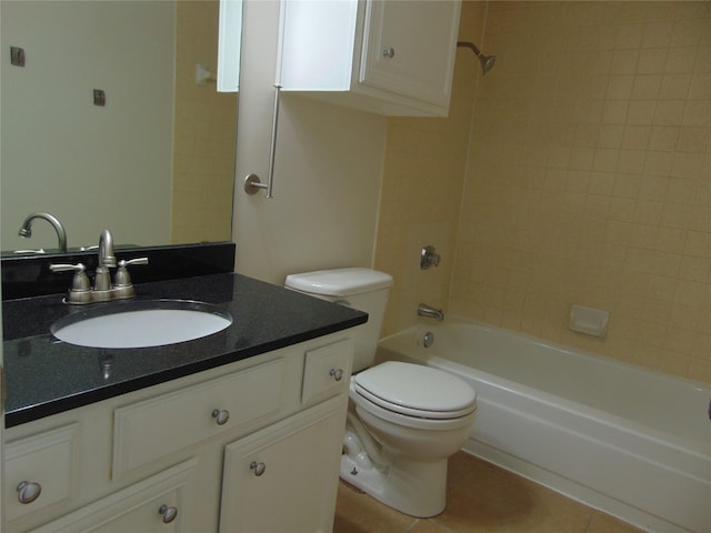 full bathroom with tile patterned floors, toilet, vanity, and tiled shower / bath