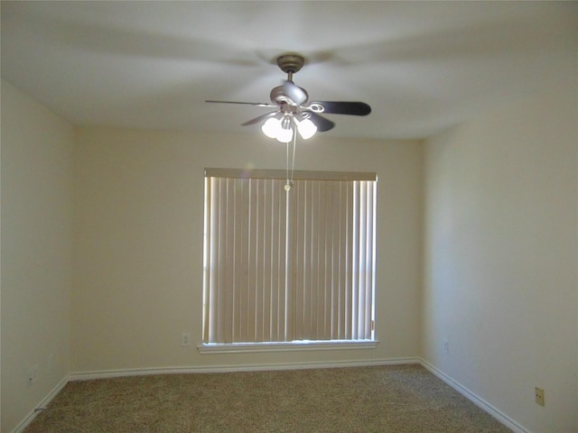 empty room featuring ceiling fan and carpet flooring