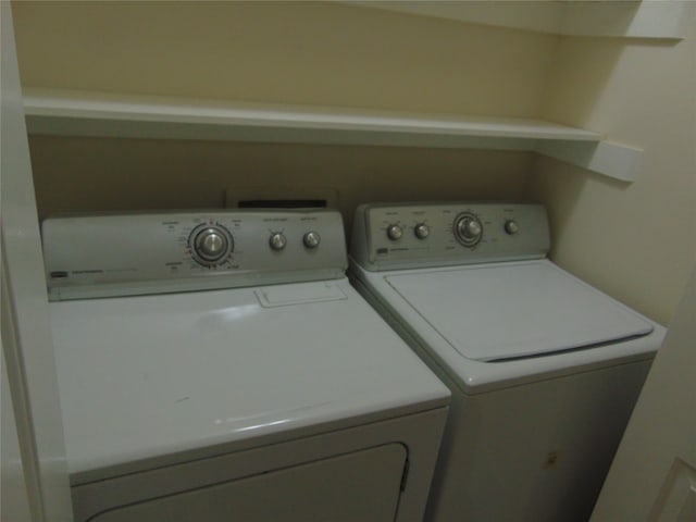 washroom featuring independent washer and dryer