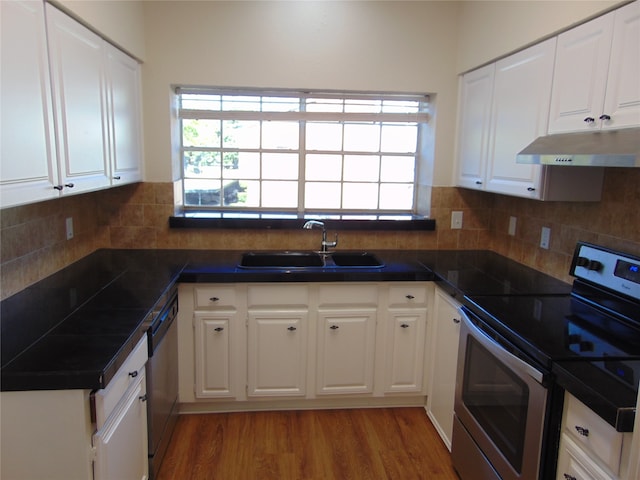 kitchen with white cabinetry, stainless steel appliances, dark wood-type flooring, and sink