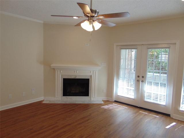 unfurnished living room with french doors, ceiling fan, a healthy amount of sunlight, and light wood-type flooring