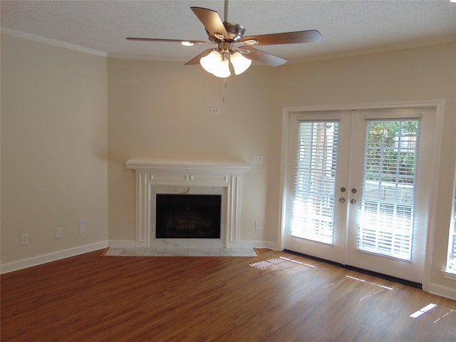 8555 Fair Oaks Xing Unit 505, Dallas, TX 75243 - unfurnished living room featuring wood finished floors, french doors, ceiling fan, ornamental molding, and a premium fireplace