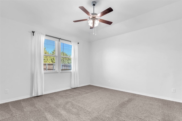 empty room with ceiling fan and carpet floors