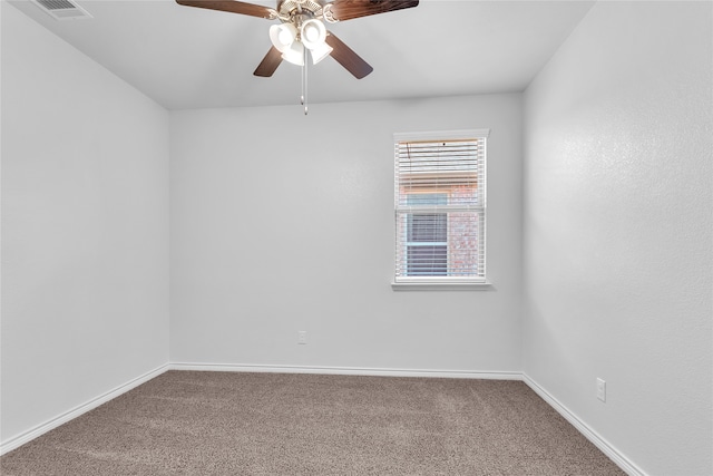 empty room featuring carpet flooring and ceiling fan