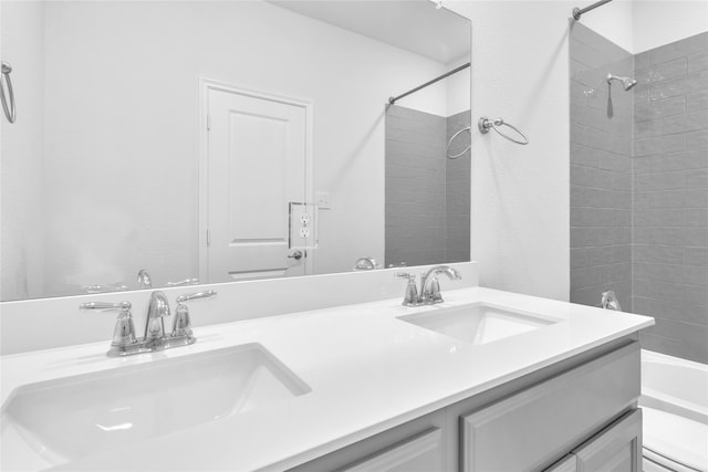 full bathroom with tiled shower / bath, vanity, and toilet