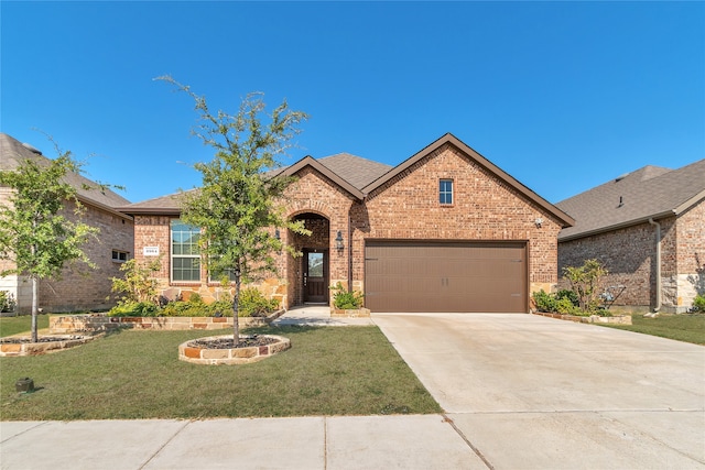 view of front of house with a front lawn and a garage