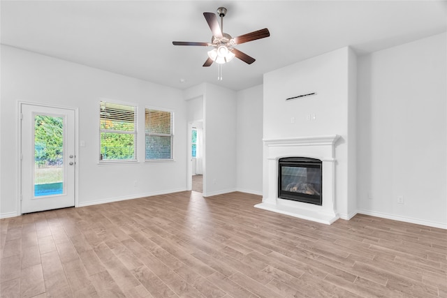 unfurnished living room with light hardwood / wood-style floors and ceiling fan