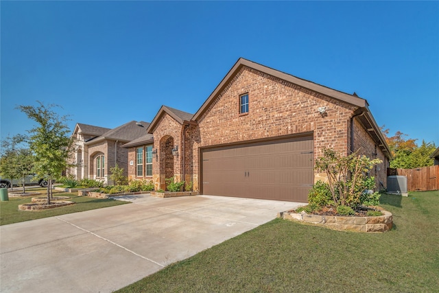 view of front facade featuring a front lawn, central AC unit, and a garage