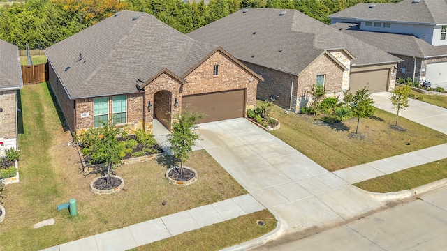 view of front facade featuring a front yard and a garage