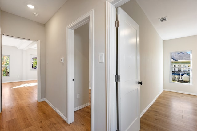 corridor featuring light hardwood / wood-style floors