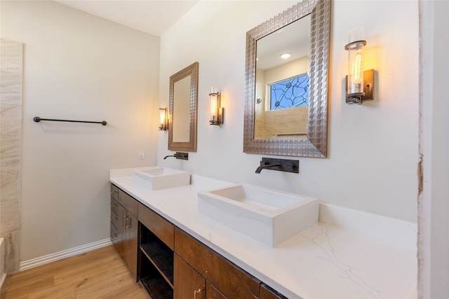 bathroom with vanity and wood-type flooring