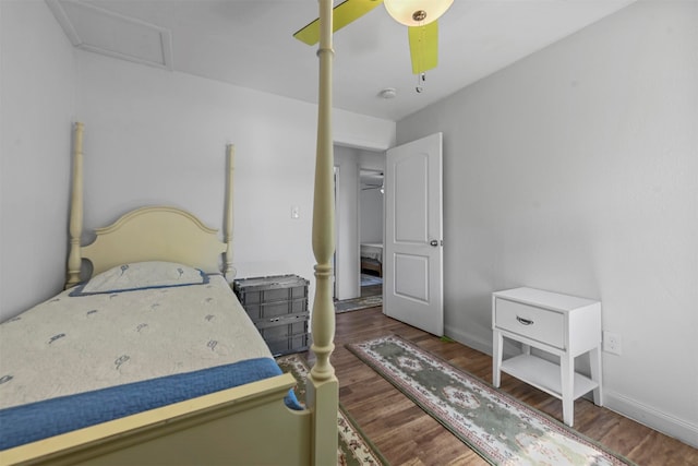 bedroom featuring ceiling fan and dark hardwood / wood-style floors