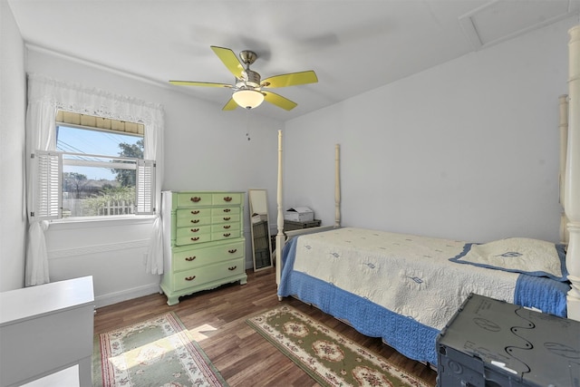 bedroom featuring dark hardwood / wood-style flooring and ceiling fan