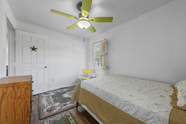 bedroom with ornamental molding, hardwood / wood-style flooring, and ceiling fan