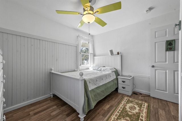 bedroom featuring dark hardwood / wood-style floors and ceiling fan