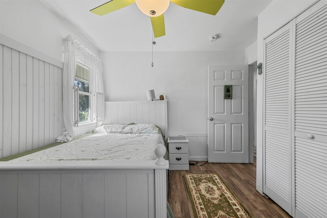 bedroom featuring a closet, ceiling fan, and dark hardwood / wood-style floors