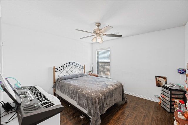 bedroom featuring dark hardwood / wood-style floors and ceiling fan