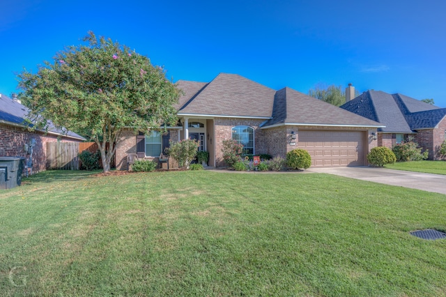 ranch-style house with a front yard and a garage