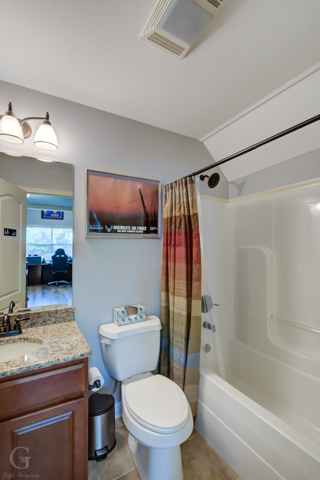 full bathroom featuring vanity, shower / tub combo with curtain, toilet, and tile patterned floors