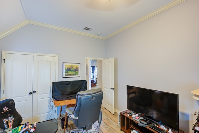 office area with crown molding, lofted ceiling, and light hardwood / wood-style flooring