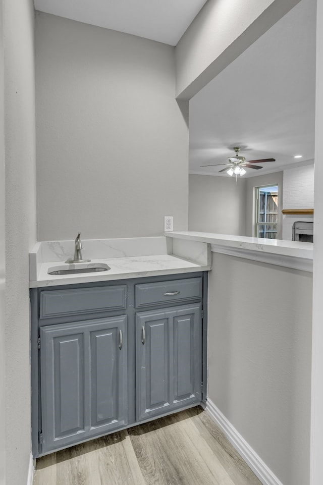 bathroom featuring vanity, hardwood / wood-style flooring, and ceiling fan