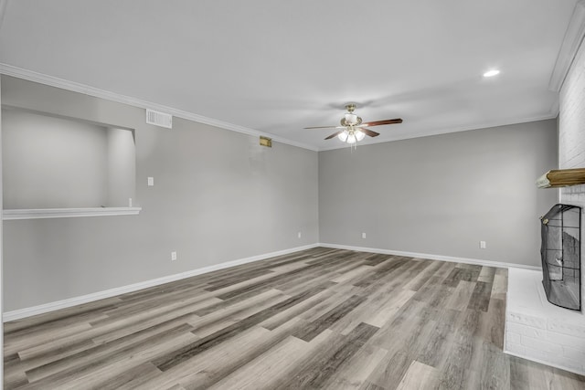 unfurnished living room with ornamental molding, light wood-type flooring, and ceiling fan