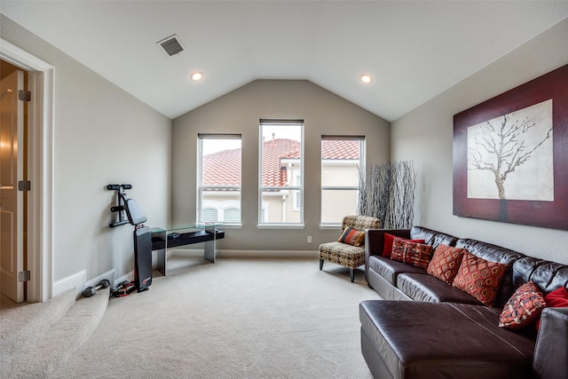 living room with vaulted ceiling and carpet flooring