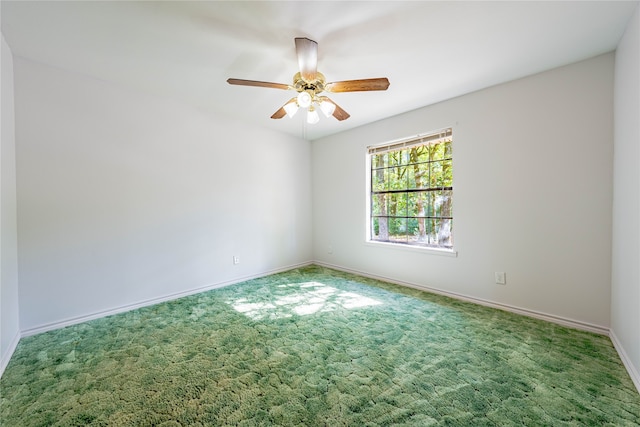 empty room featuring carpet flooring and ceiling fan