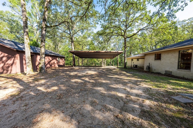 view of yard with a carport