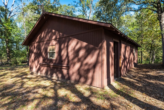 view of side of home with an outdoor structure