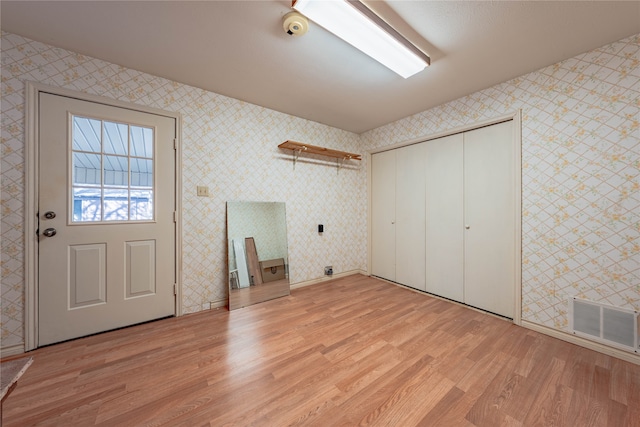 laundry room featuring light hardwood / wood-style flooring