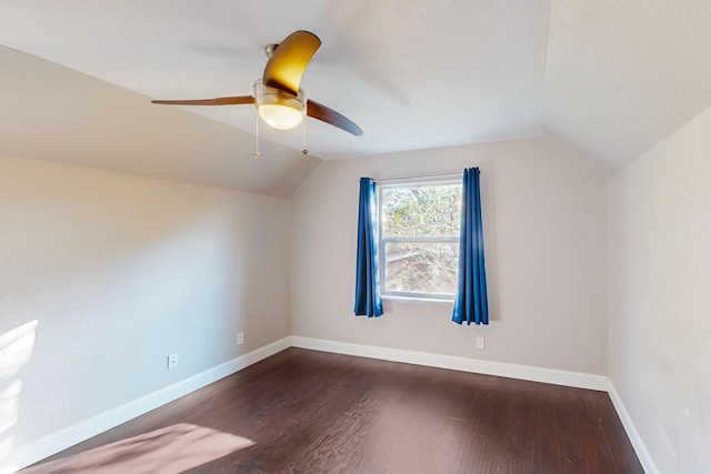 bonus room with ceiling fan, vaulted ceiling, and dark hardwood / wood-style flooring