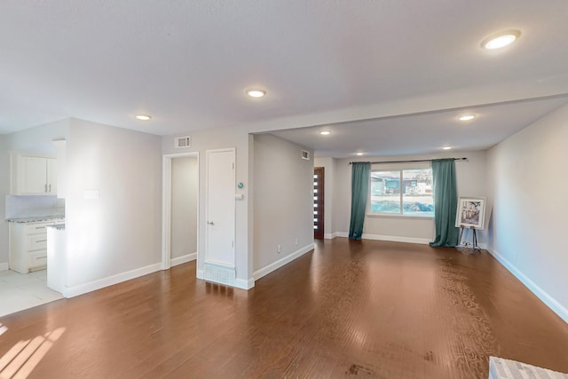 unfurnished living room featuring light wood-type flooring