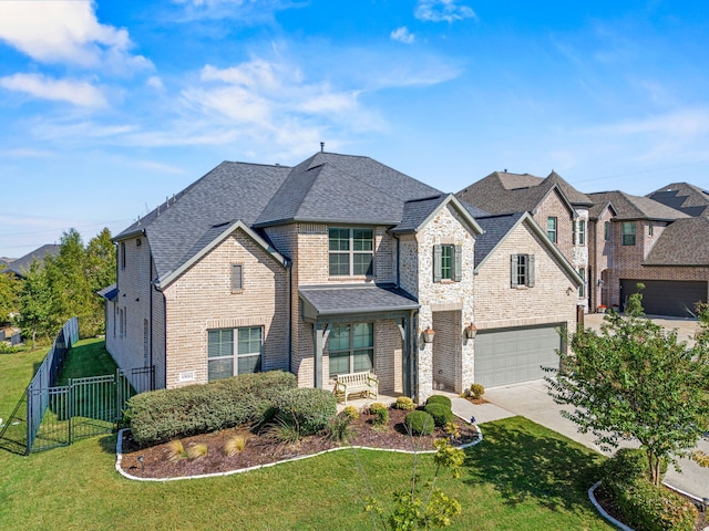 view of front facade featuring a front lawn and a garage