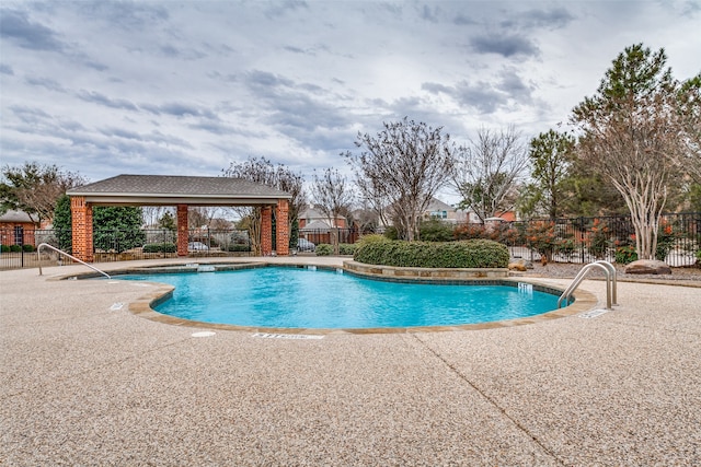 view of swimming pool featuring a gazebo and a patio