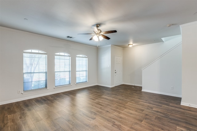 unfurnished room featuring ceiling fan, dark hardwood / wood-style flooring, and crown molding