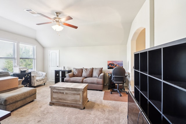 living room featuring ceiling fan, light colored carpet, and vaulted ceiling