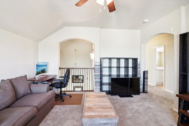 carpeted living room featuring vaulted ceiling and ceiling fan