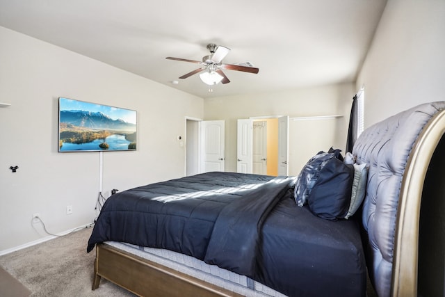 carpeted bedroom featuring ceiling fan