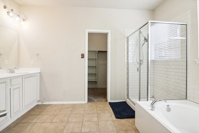 bathroom with vanity, independent shower and bath, and tile patterned floors