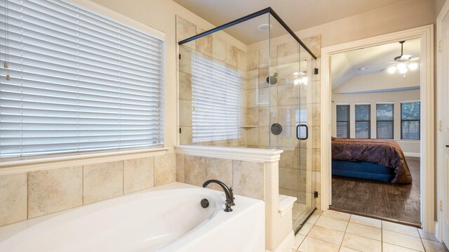 3123 Pamplona, Grand Prairie, TX 75054 - ensuite bathroom with a bath, a ceiling fan, a stall shower, tile patterned floors, and vaulted ceiling
