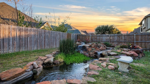 3123 Pamplona, Grand Prairie, TX 75054 - fenced backyard with a small pond