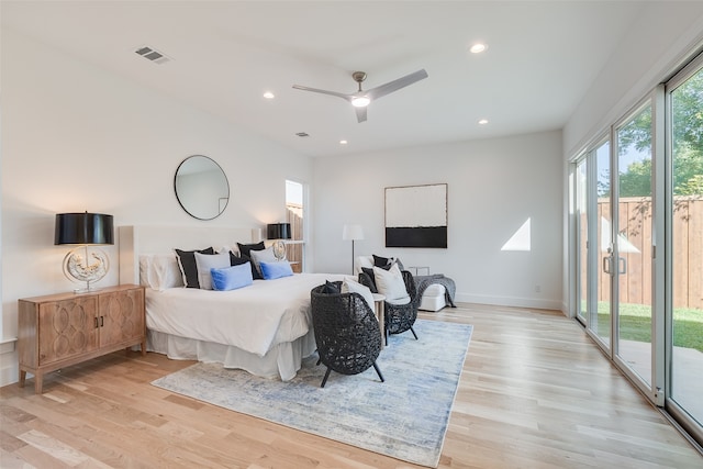 bedroom with light hardwood / wood-style floors, access to outside, and ceiling fan