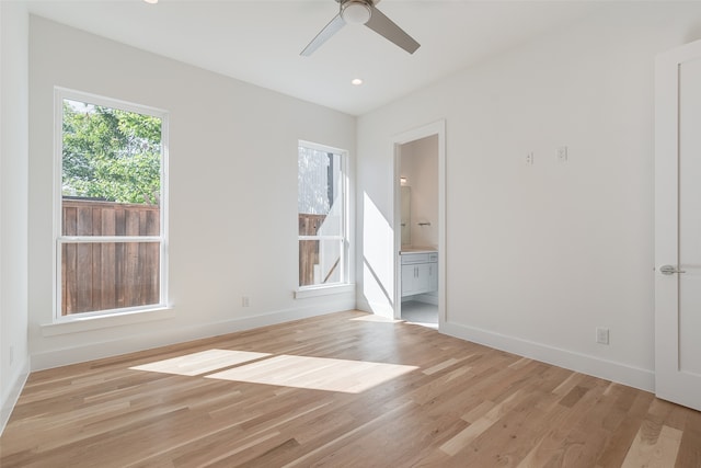 unfurnished room featuring light hardwood / wood-style flooring and ceiling fan