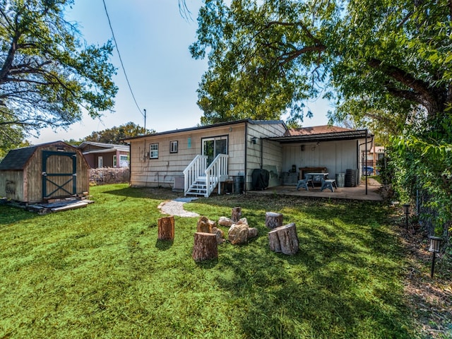 back of house featuring a patio area, a yard, and a storage unit