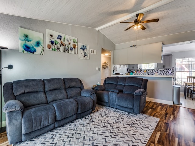 living room with ceiling fan, lofted ceiling, and hardwood / wood-style floors