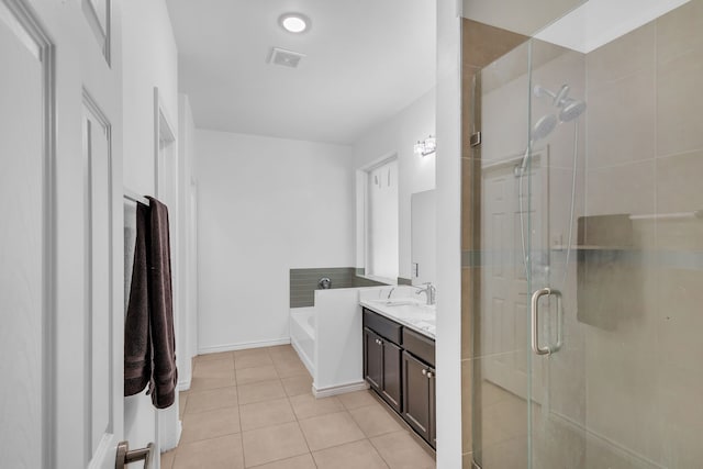 bathroom with vanity, separate shower and tub, and tile patterned flooring