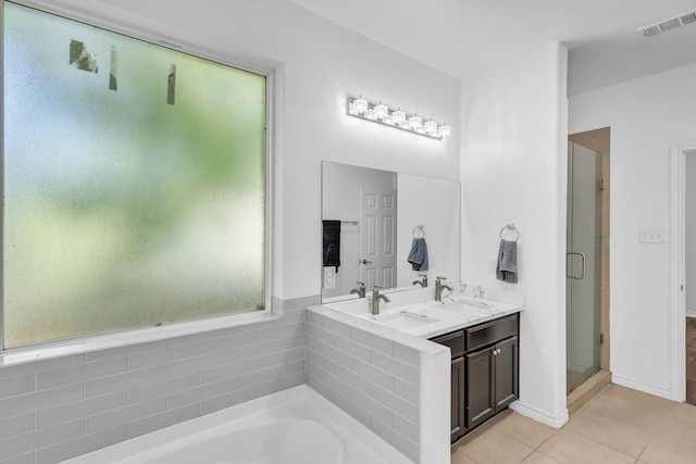 bathroom featuring vanity, tile patterned floors, and separate shower and tub