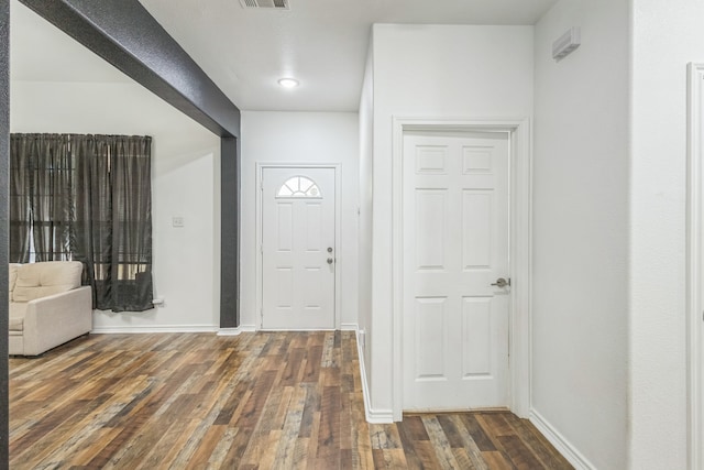 foyer with dark hardwood / wood-style floors